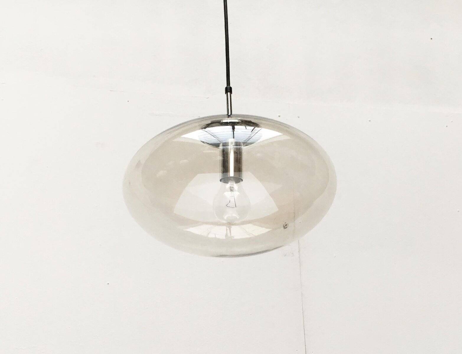 Suspended UFO-shaped glass luminaires in mid-century German Space Age style, set of 3.