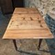 Vintage French pine table with extendable side, circa 1930, suitable for kitchen or office use.