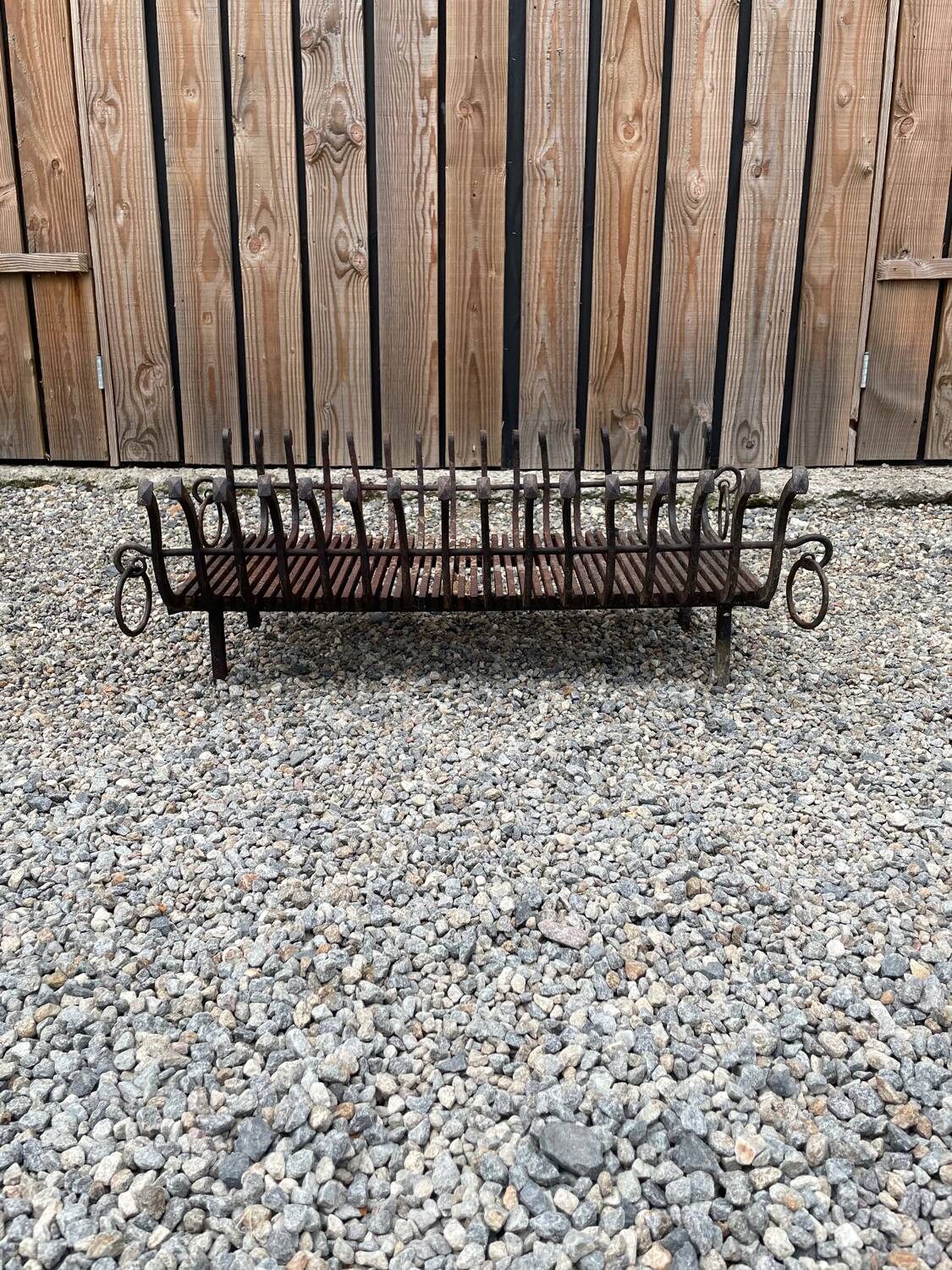 Vintage cast iron fireplace cradle with 16 bars.