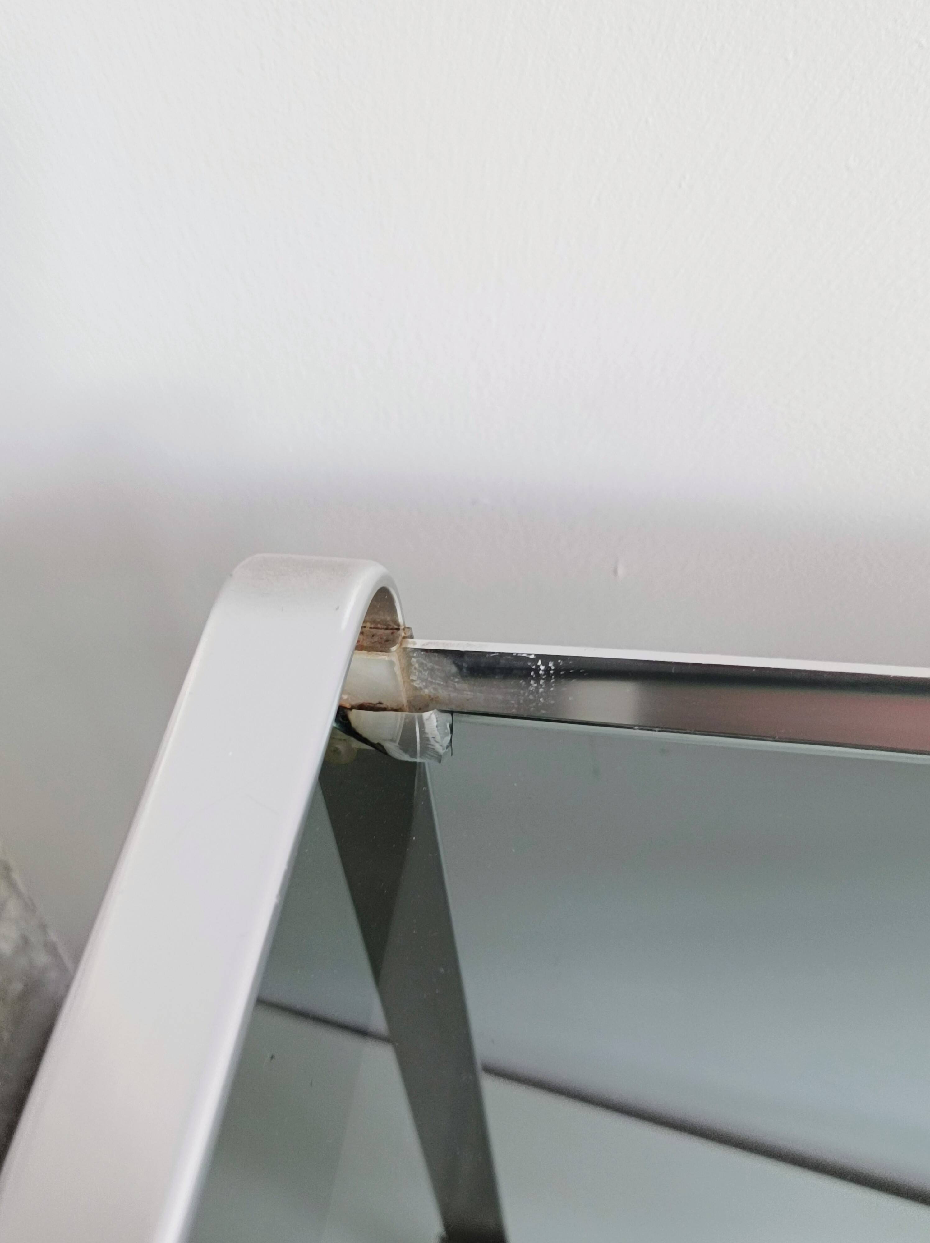 Nested tables in aluminium and smoked glass by Martini & Rossi, 1970s.