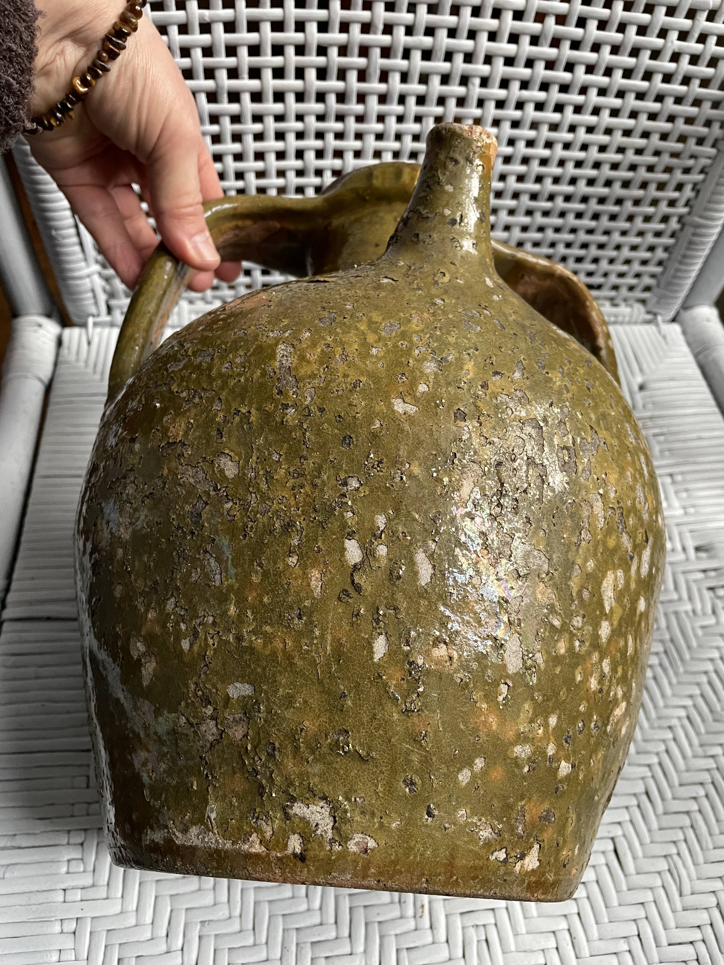 Khaki green glazed terracotta oil jar, 18th-19th century