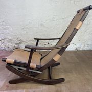 Colonial style leather armchair and ottoman