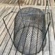 Foldable black woven metal wastepaper basket from around 1950.