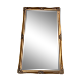 Grand miroir en bois sculpté doré