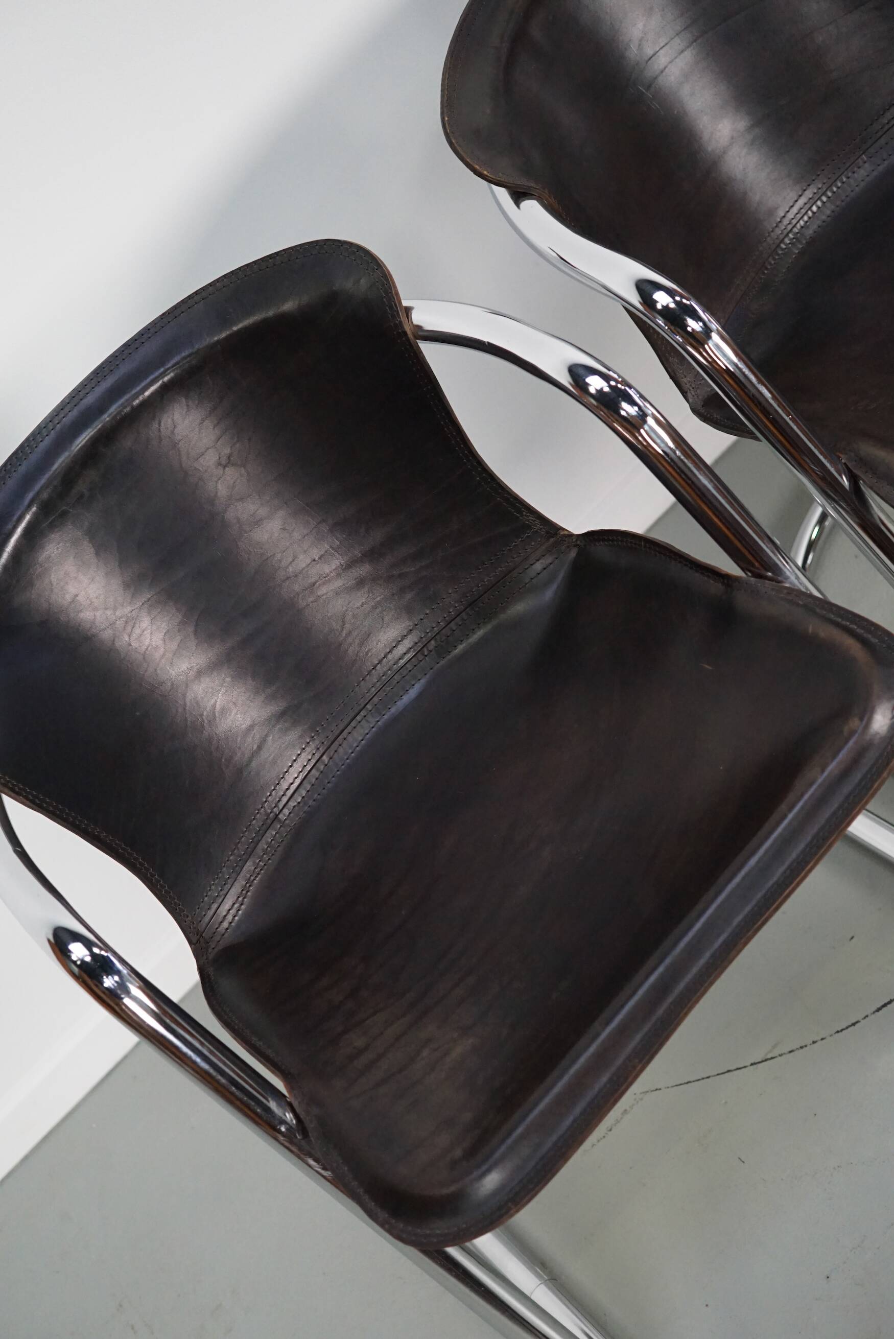 Set of four brown leather dining chairs, Willy Rizzo, 1970