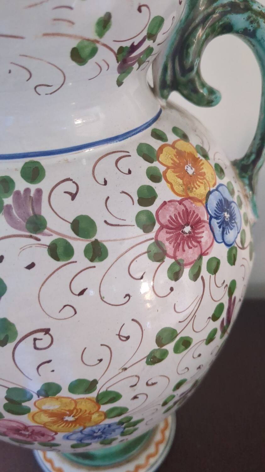Old porcelain earthenware vase with floral decor