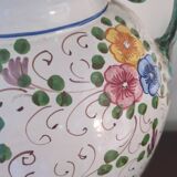 Old porcelain earthenware vase with floral decor