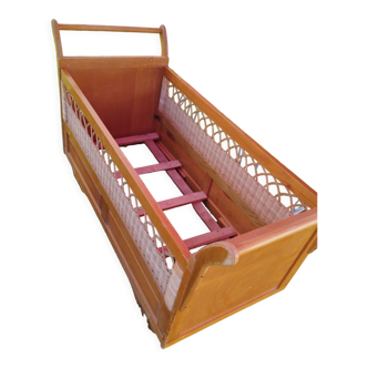 Wooden and wicker cot