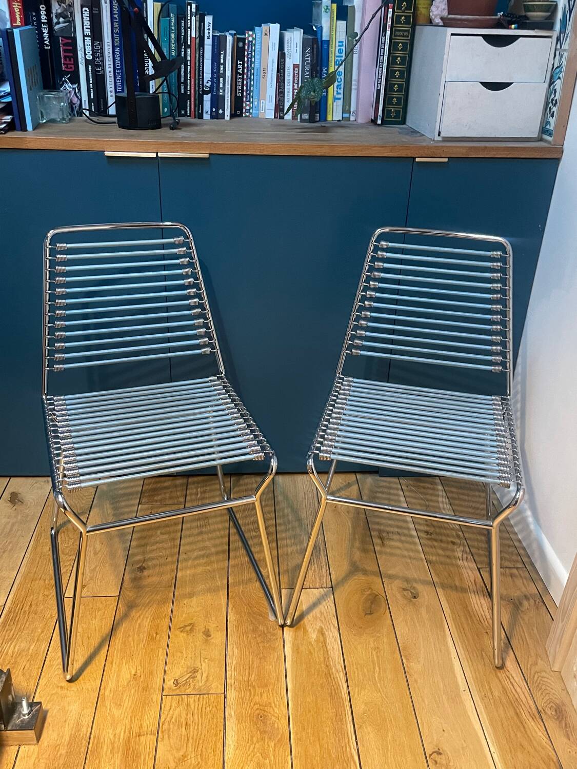 2 metal chairs with bungee cords