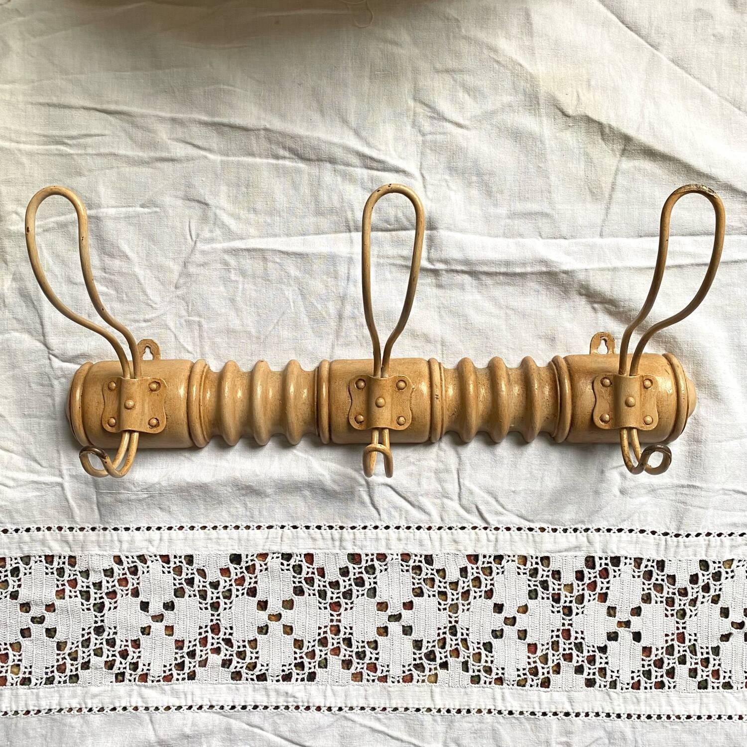 Turned wood wall coat rack