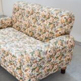 2-seater sofa, floral fabric, wooden structure, plastic and wooden legs, 1970