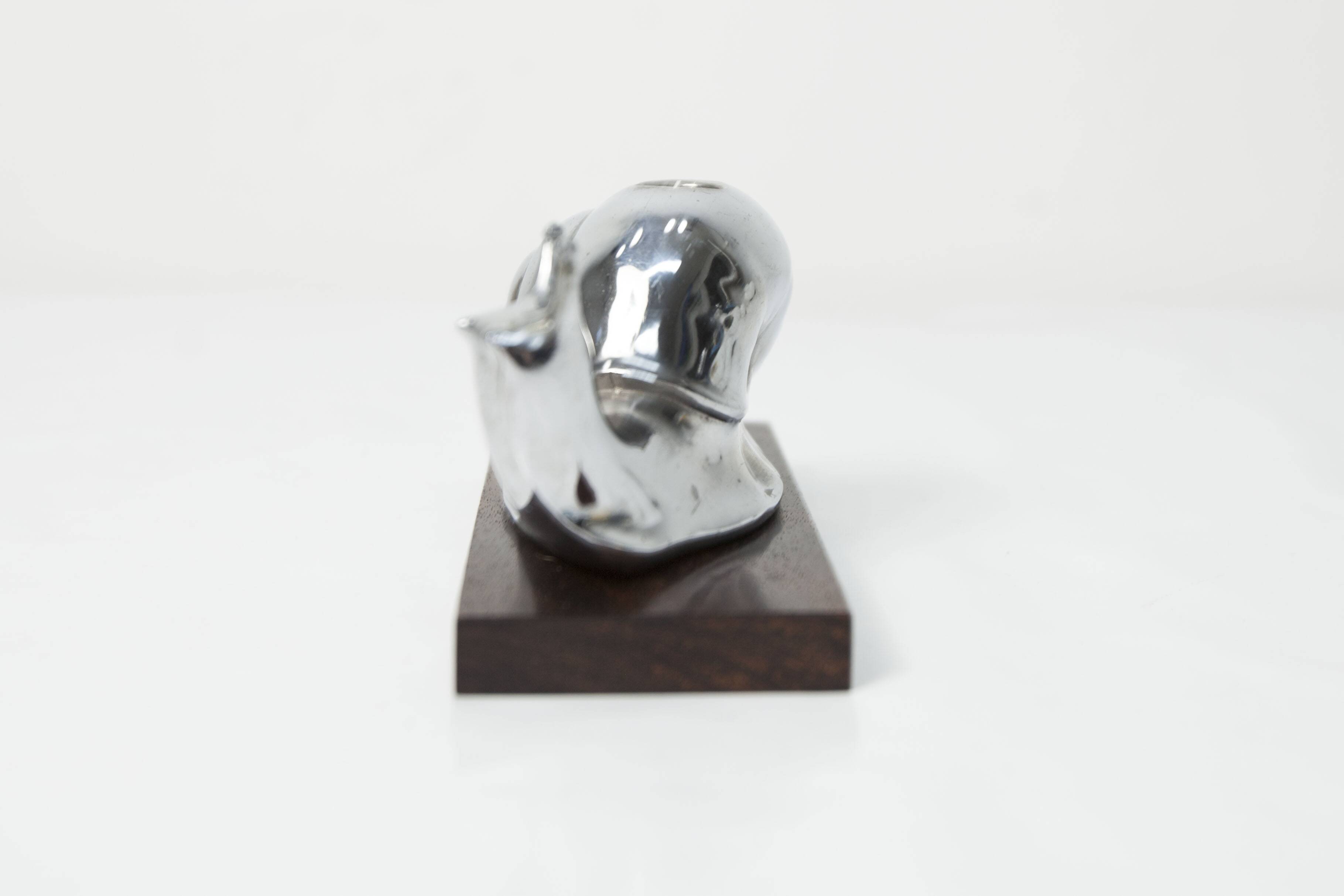 Silver snail candlestick on a teak base 1960