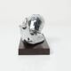 Silver snail candlestick on a teak base 1960