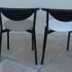 6 gondola-style chairs with a sturdy metal frame and faux leather.