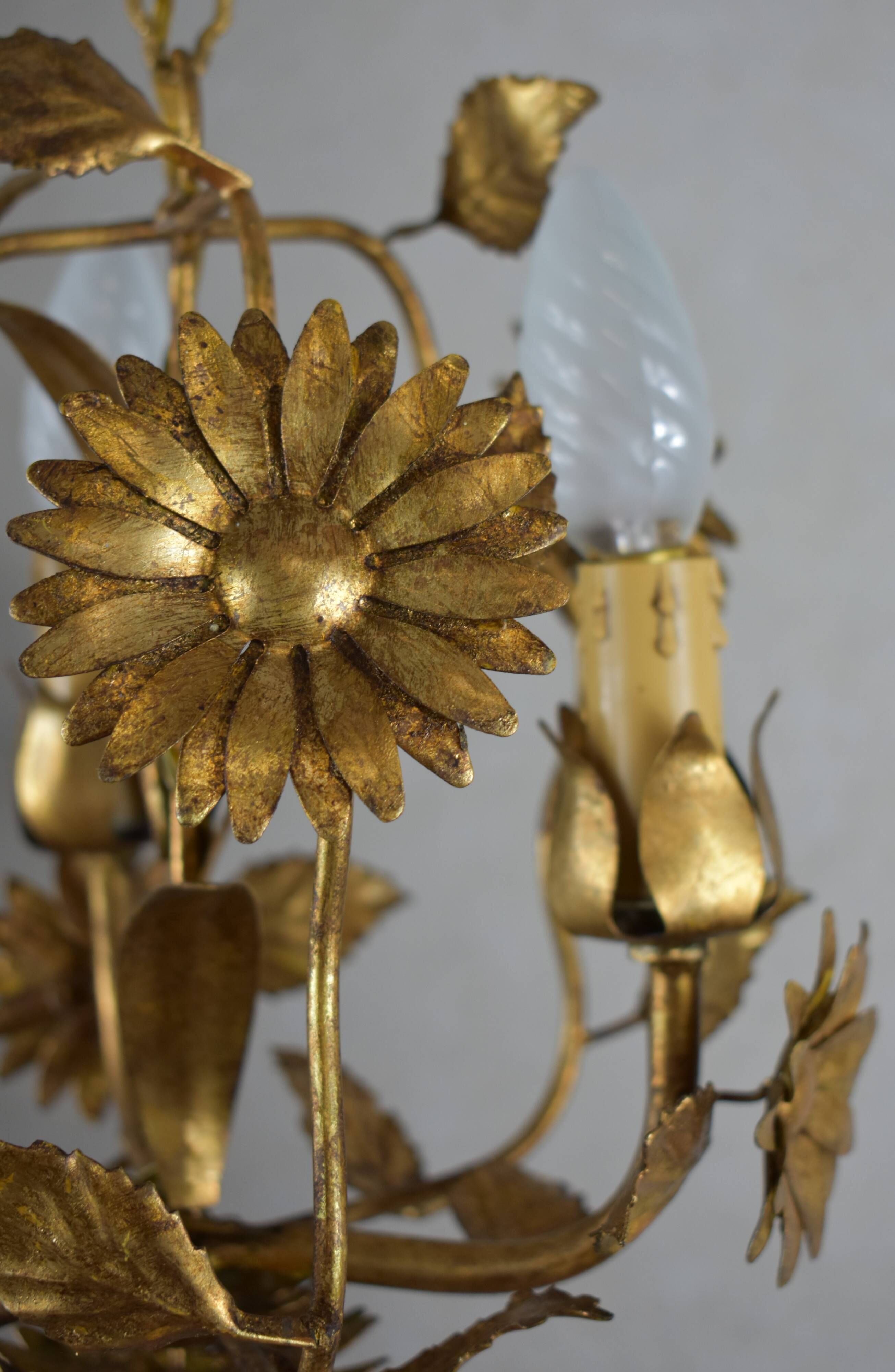 golden chandeliers with flowers.