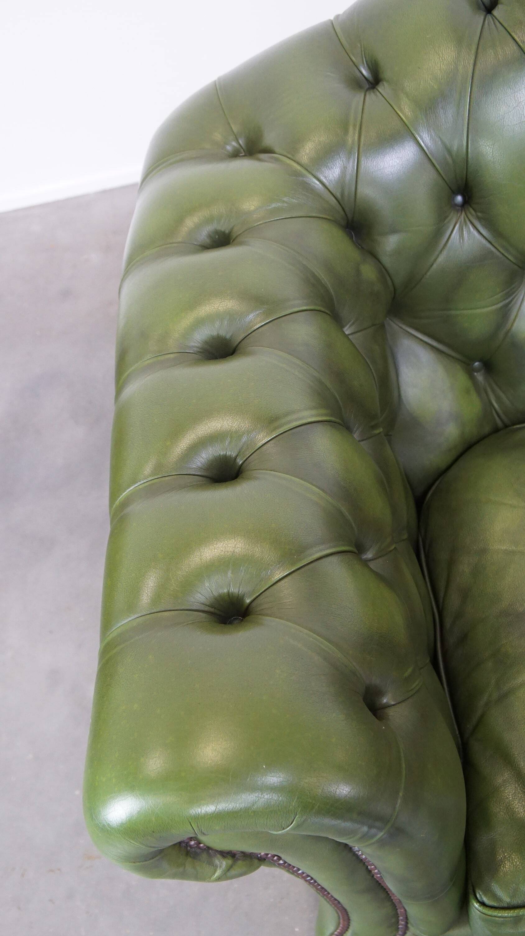 Stylish, English green cow leather spacious 2.5 seater chesterfield sofa
