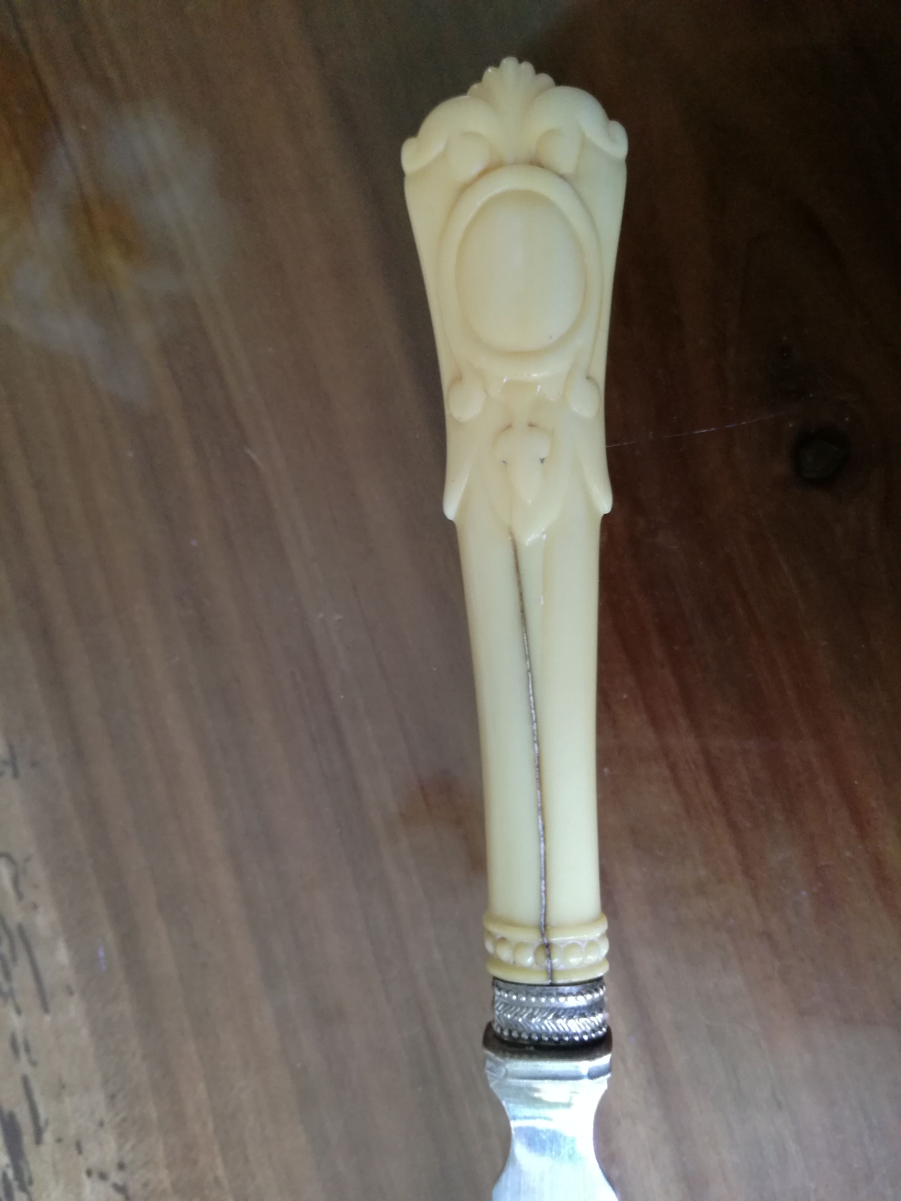 Silver and ivory paper cut