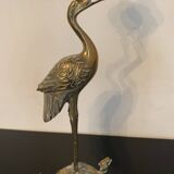 Pair of chiseled and gilded bronze candlesticks depicting perched waders