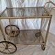 Rolling dessert trolley in gilded brass & glass from the 1970s in the style of Maison Jansen.