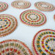 Set of coasters and bottles in colored wicker
