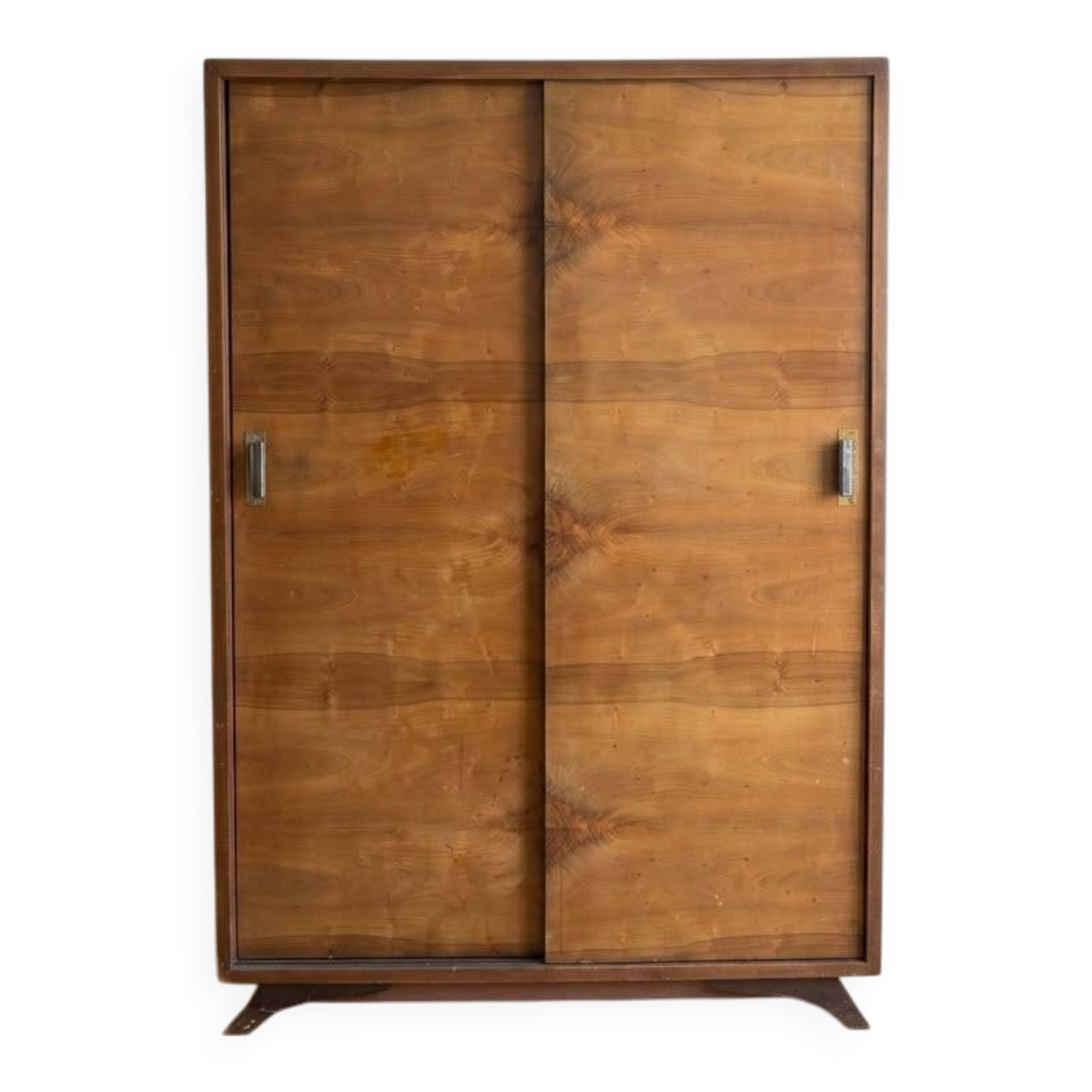 Vintage 1950s wardrobe with sliding wooden doors.