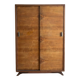Vintage 1950s wardrobe with sliding wooden doors.