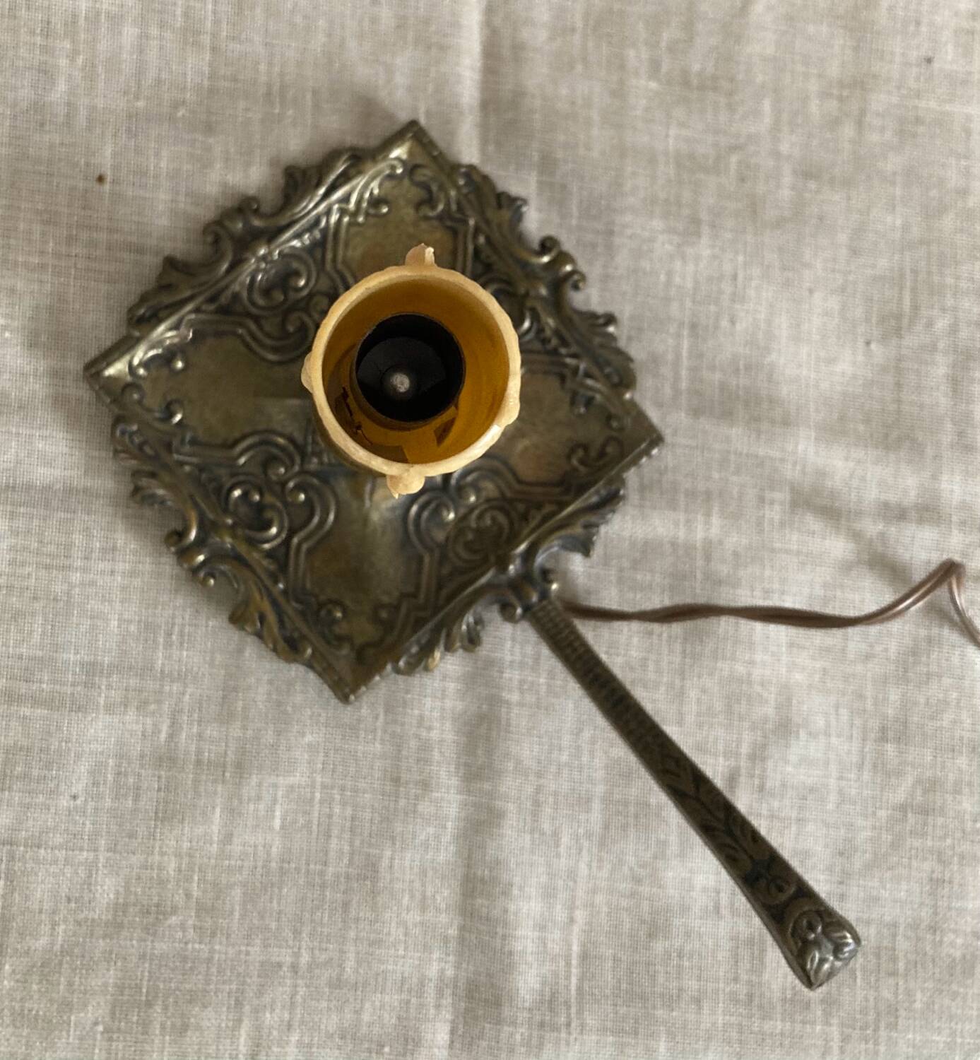 Candle holder with 20th century spelter socket mounted as a flame bulb lamp