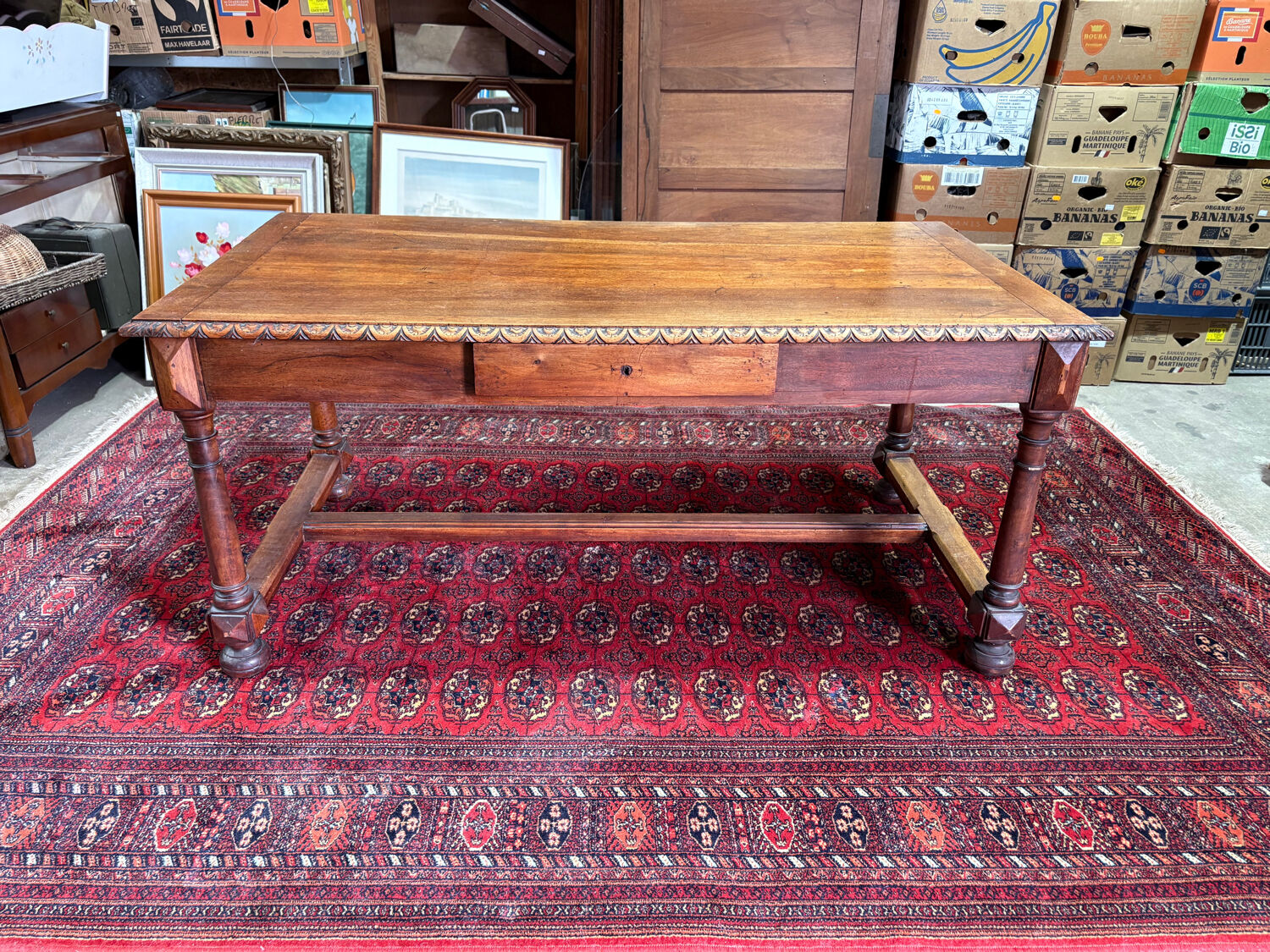 Large antique carved wooden desk in Renaissance style