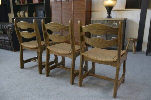 Set of 6 oak dining chairs with rush seat and 'Echelle' backrest in the style of Guillerme et Chambron 1950s