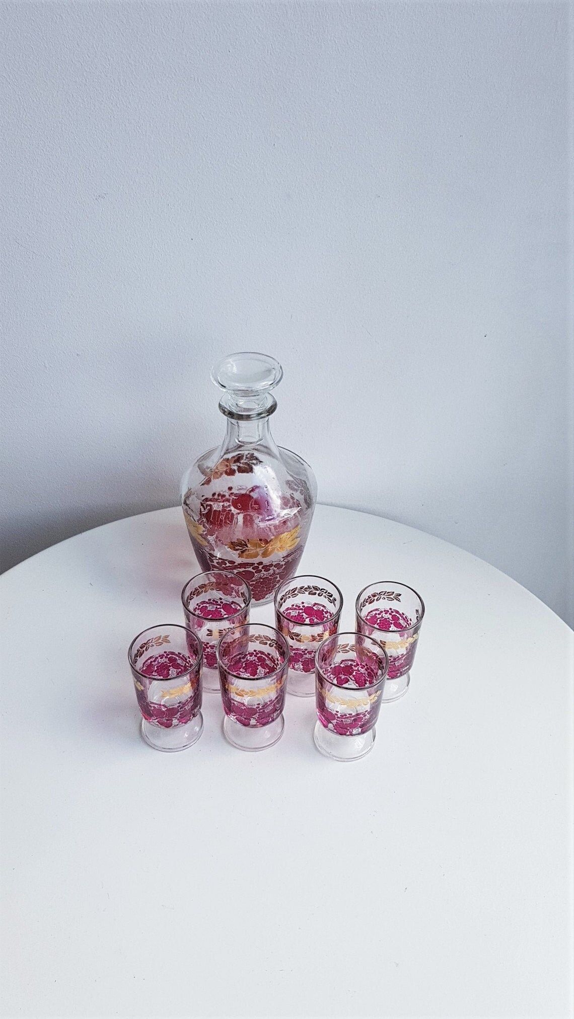 Pink and gilded glass liquor service