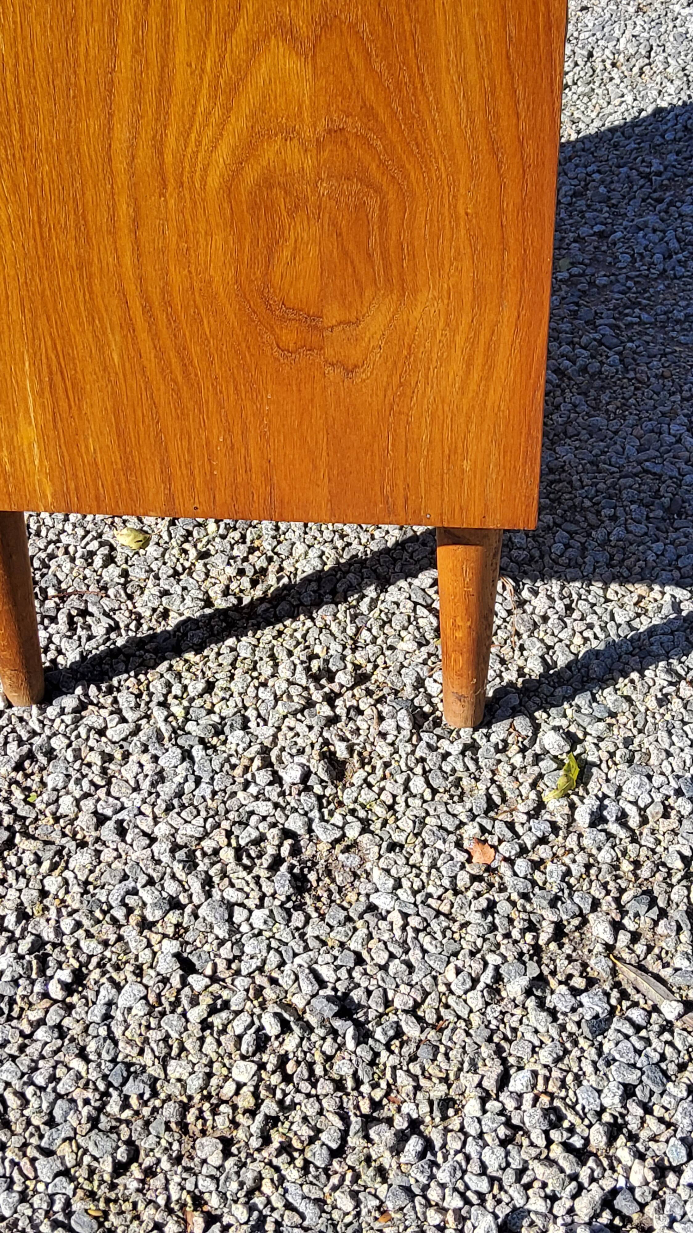 Vintage golden oak sideboard with conical legs from the 1950s