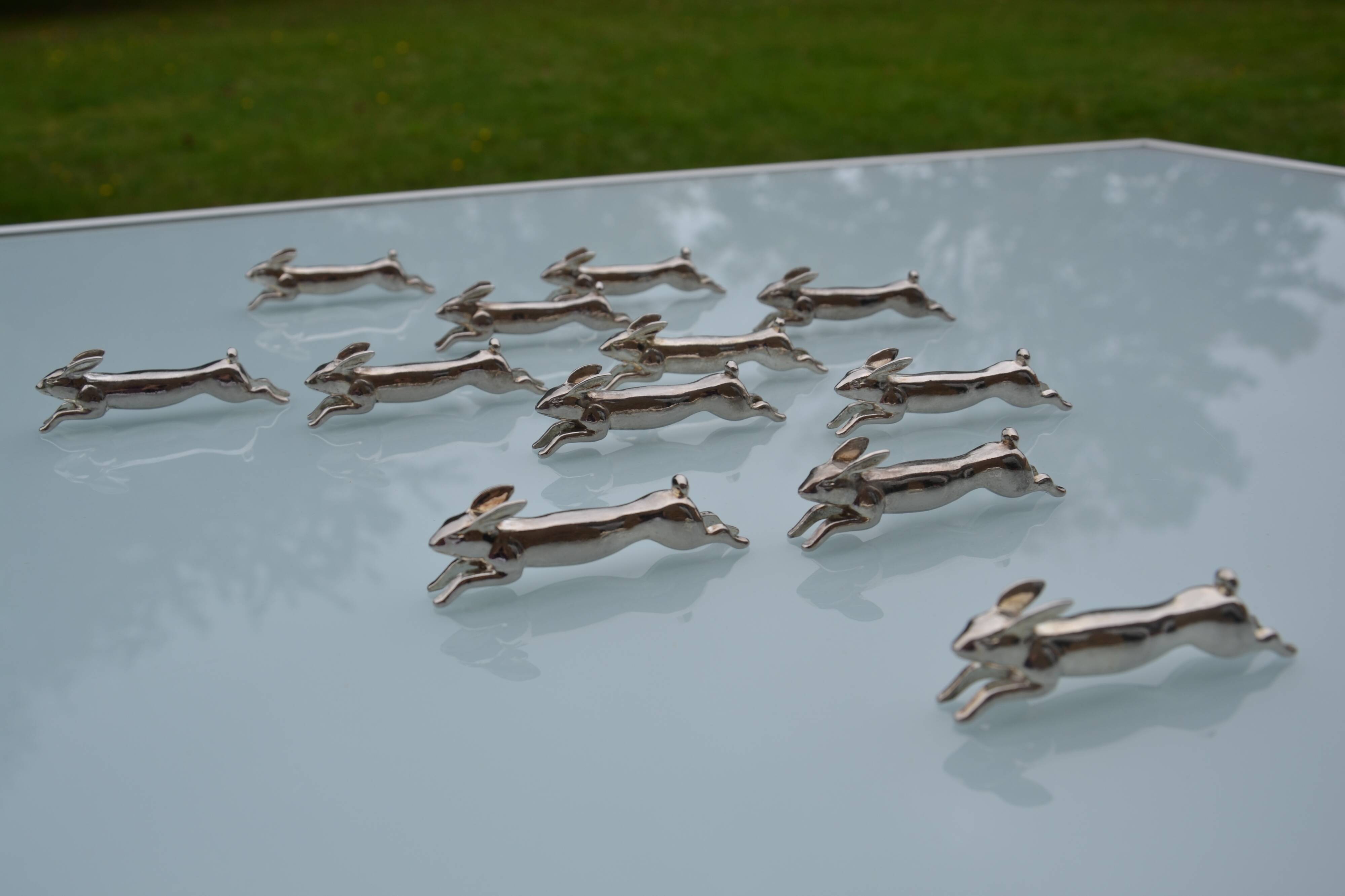12 silver-plated metal "rabbit" knife rests