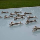 12 silver-plated metal "rabbit" knife rests