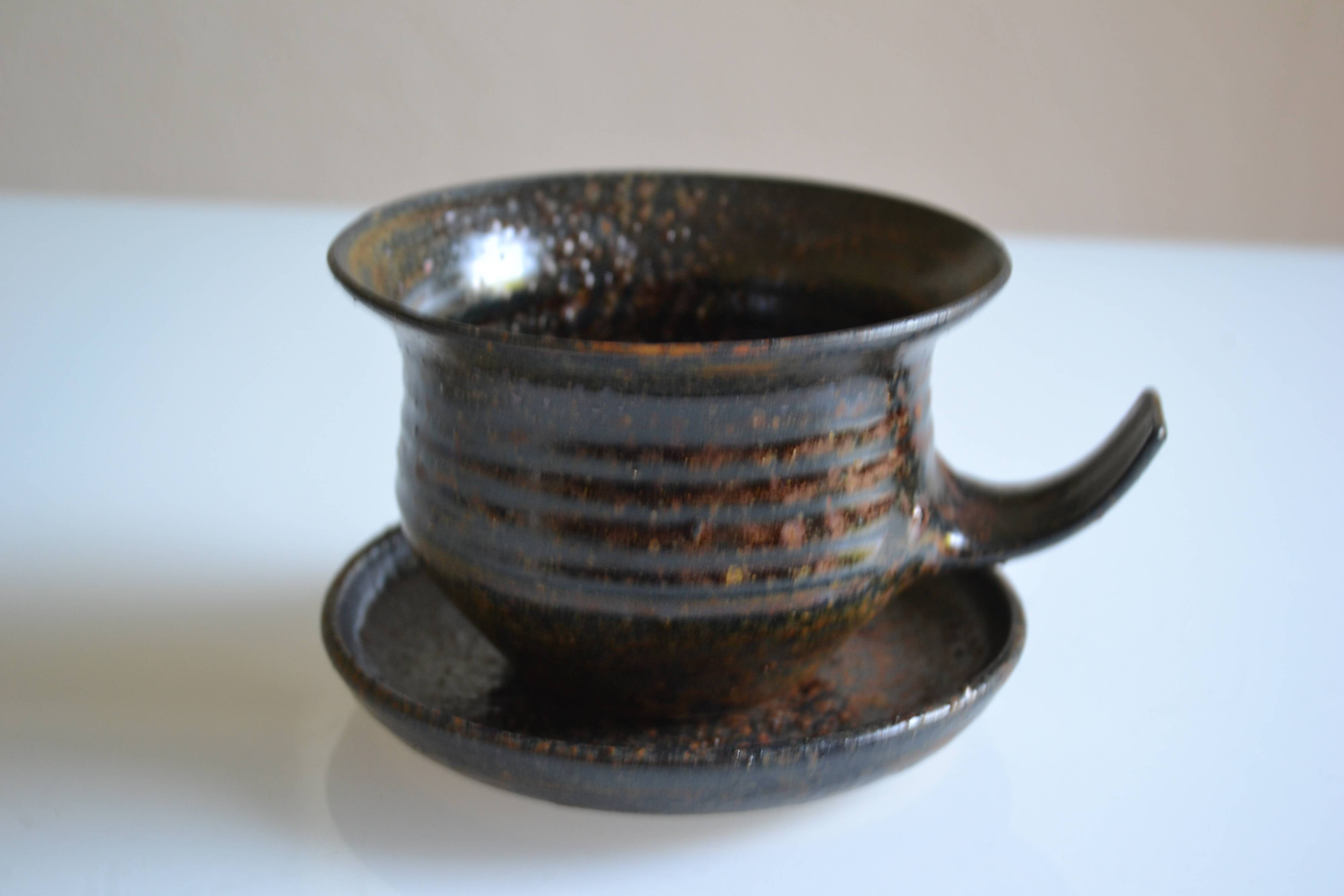 1970s ceramic cup and saucer signed