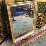 Miroir Empire à palmettes feuille d’or restauré