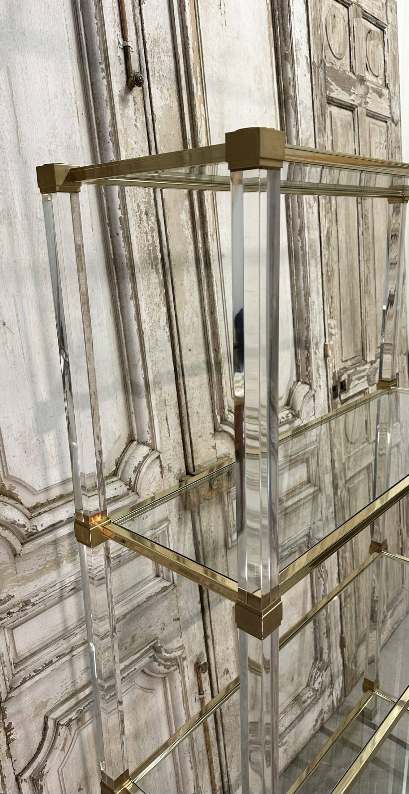 Plexiglass shelf by Pierre Vandel in Hollywood Regency style circa 1970.