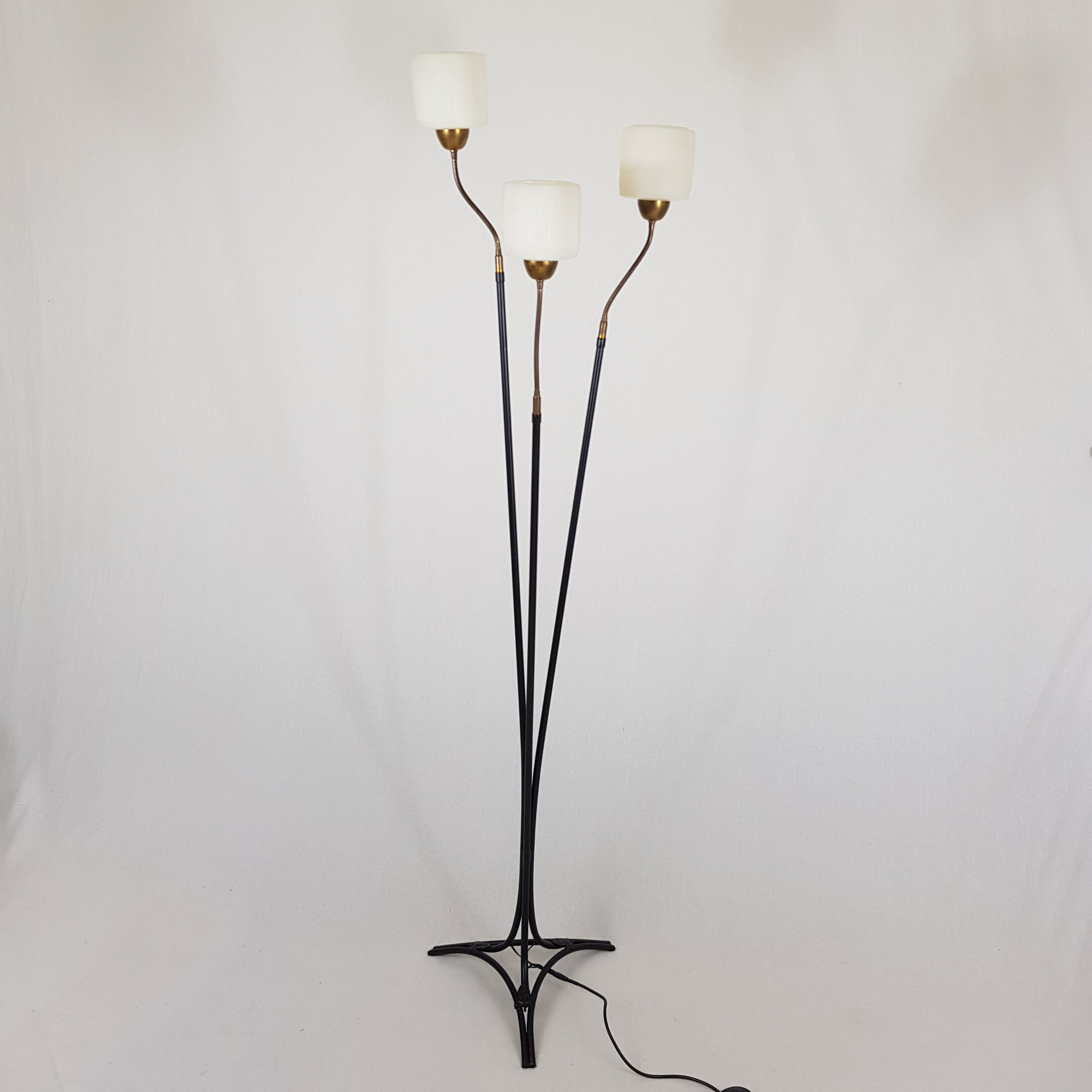 Golden brass tripod lamppost