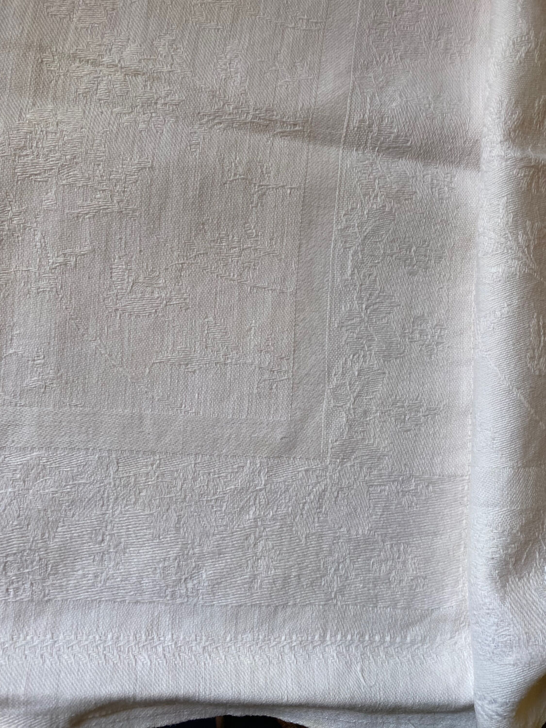 Pair of embroidered white cotton tea towels.