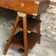 Walnut desk with green leather top resting on two trestles