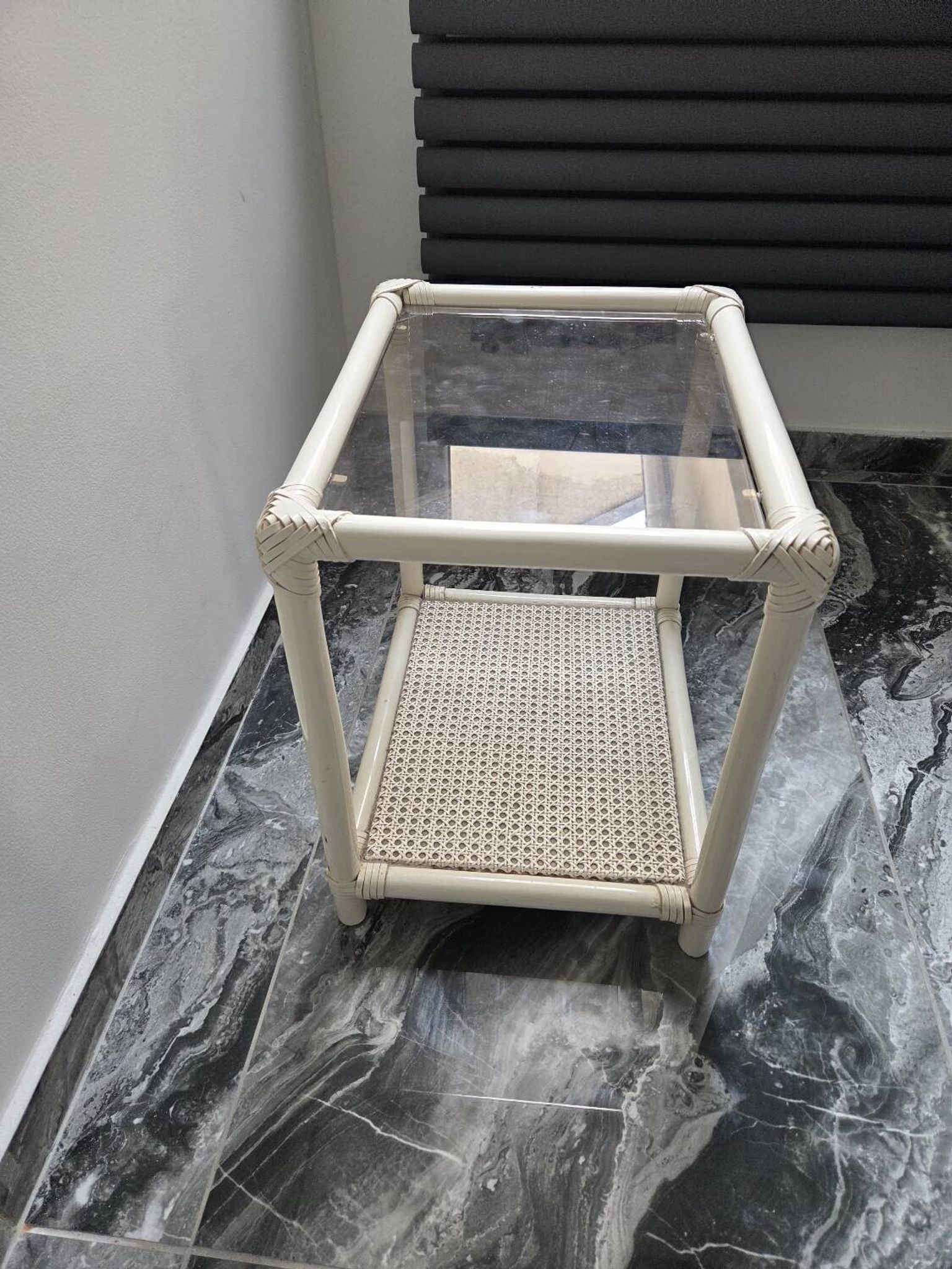 Rattan and cane side table with tinted glass top