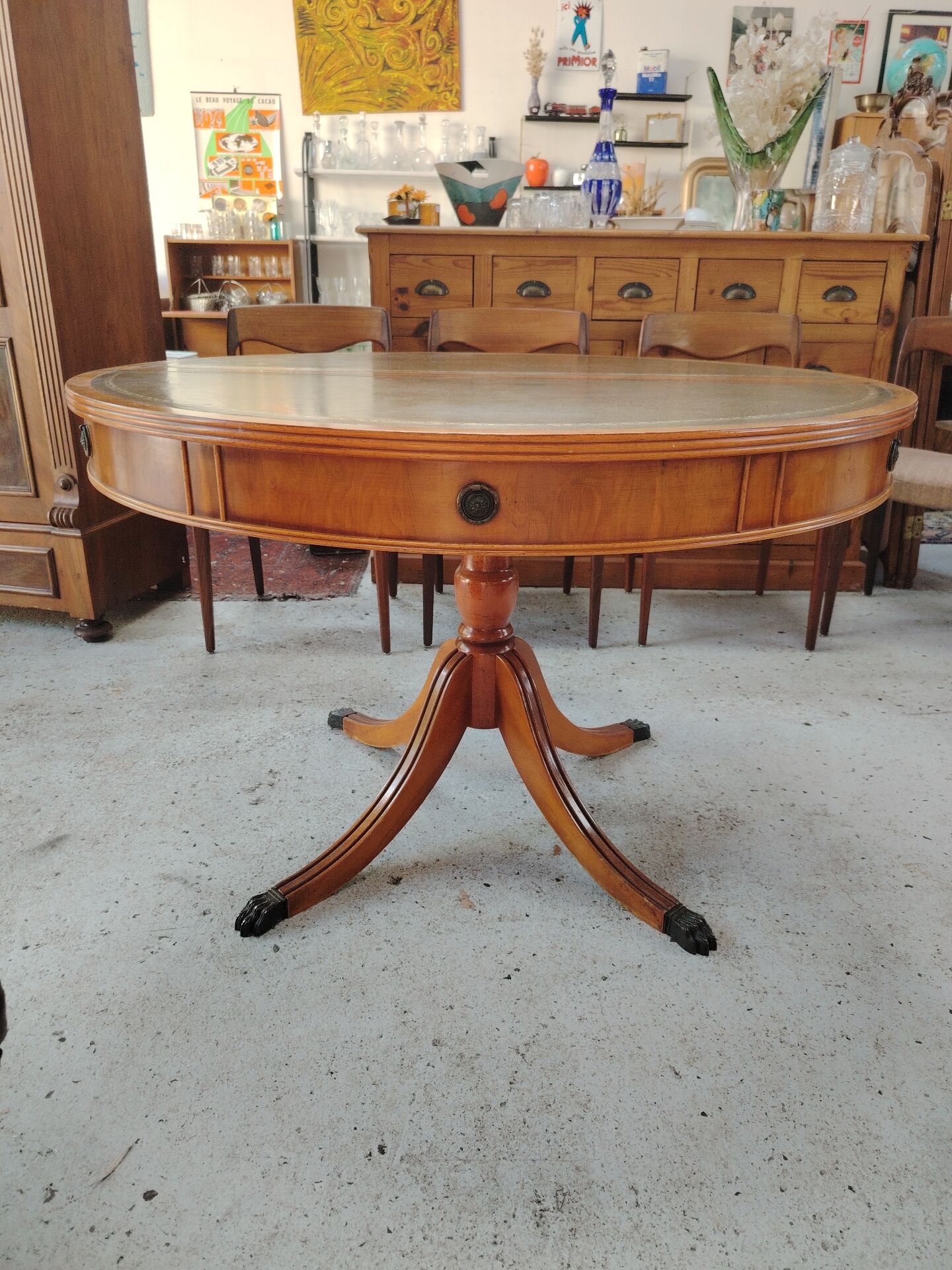 Round Regency dining table in mahogany and green leather with extensions - 20th century