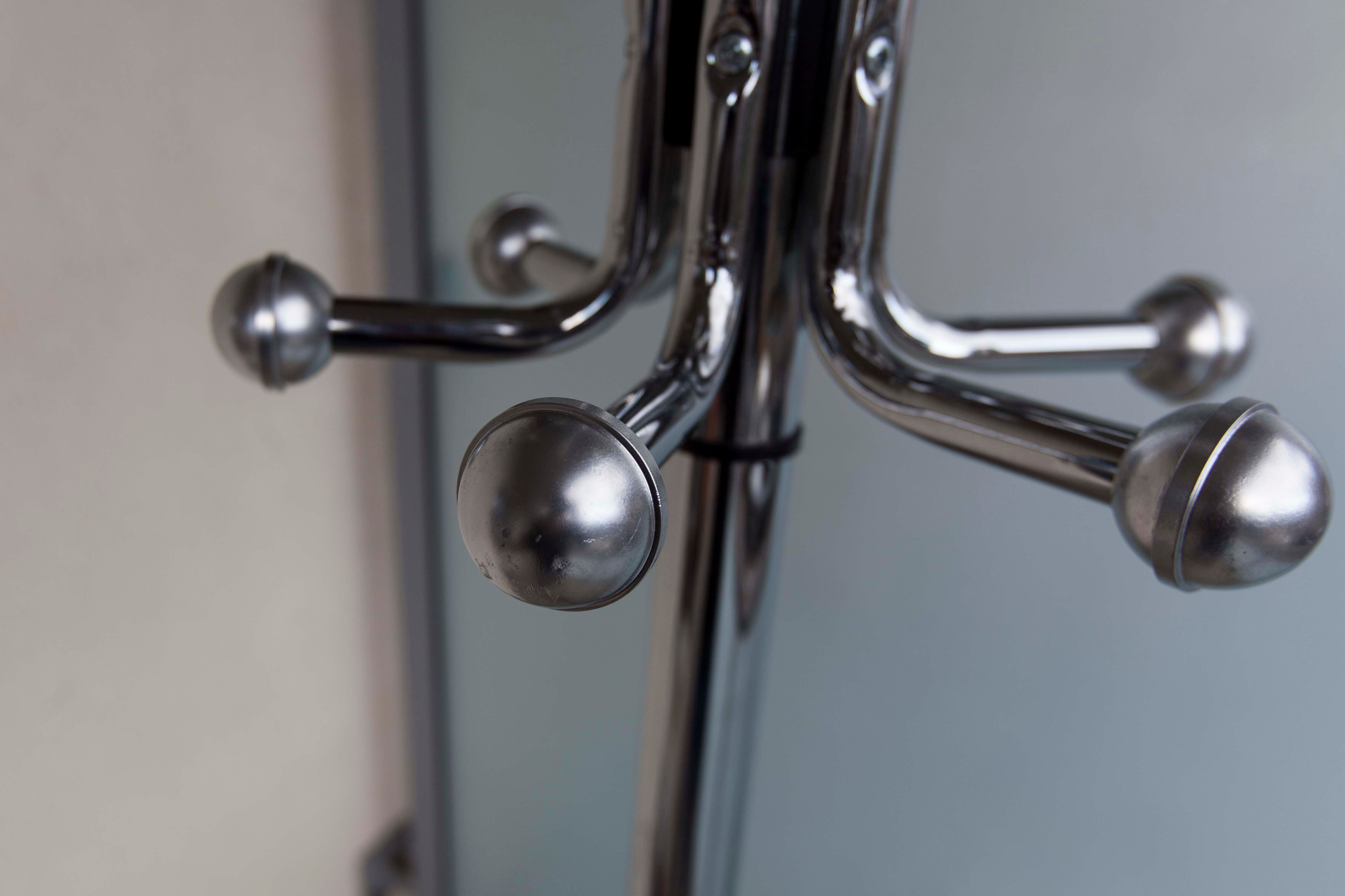 Chrome metal parrot coat holder from the 70s