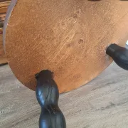 Brown and black wooden tripod stool
