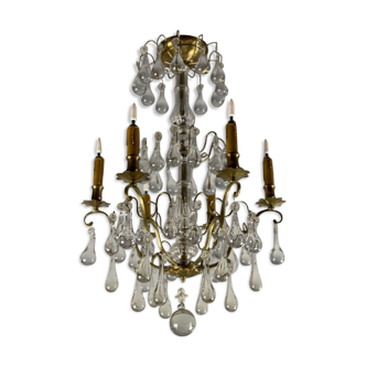 Gilded bronze chandelier trimmed with drop-shaped stamps