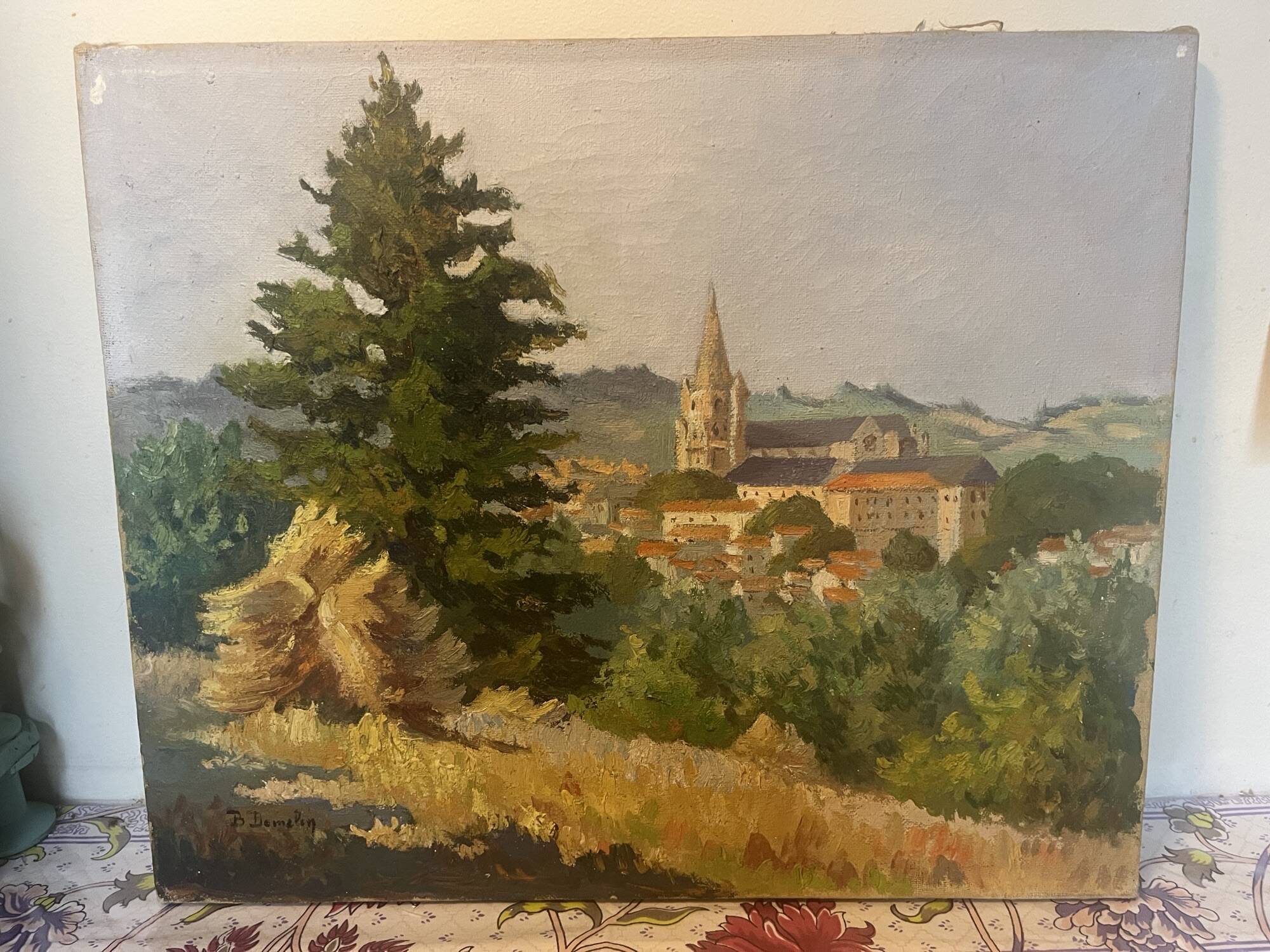 Oil on canvas rural landscape, village steeple and its countryside.