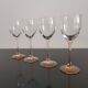 4 Luminarc white wine glasses with pink feet