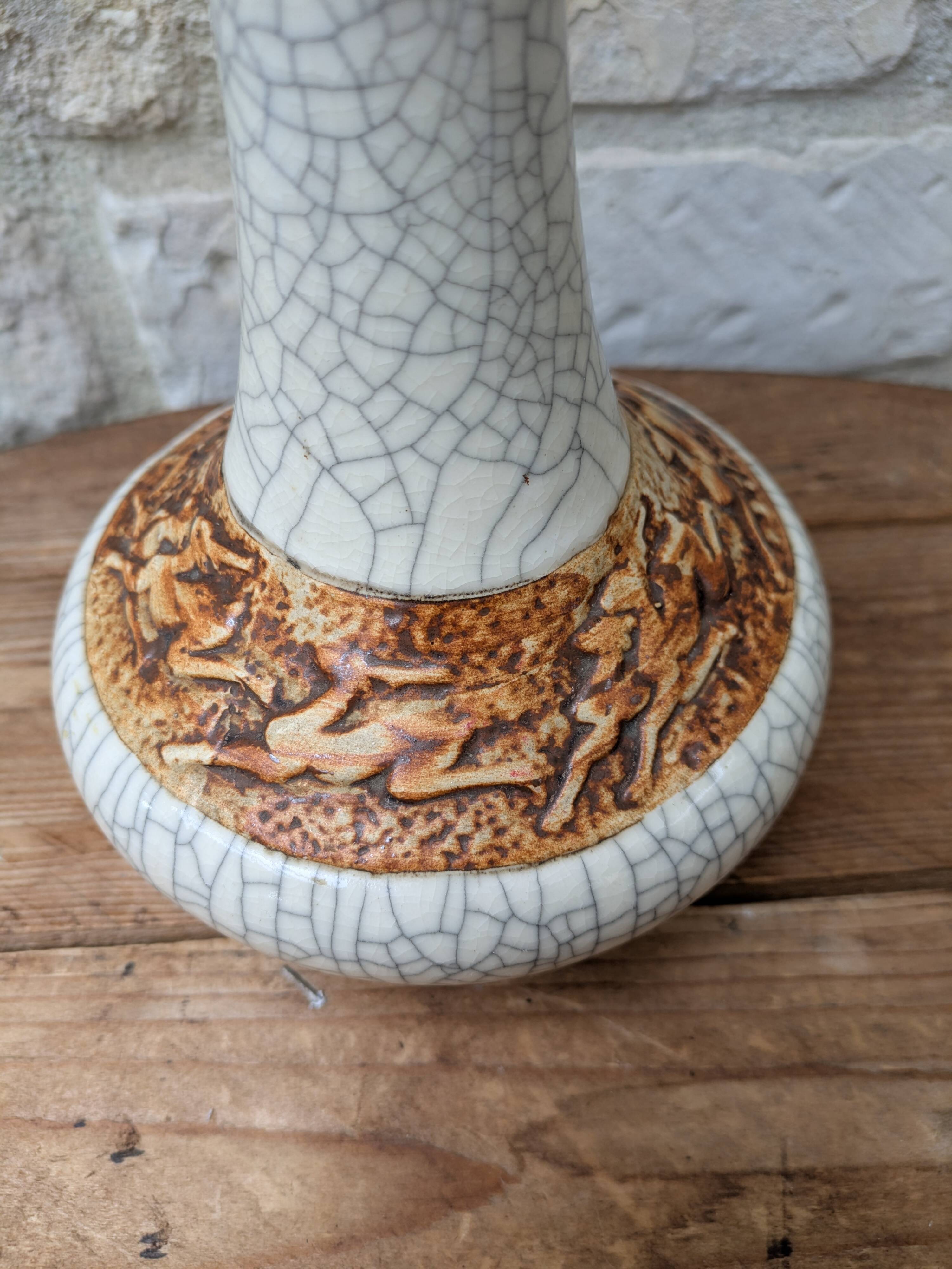 Antique long-necked vase in cracked white ceramic with deer decoration