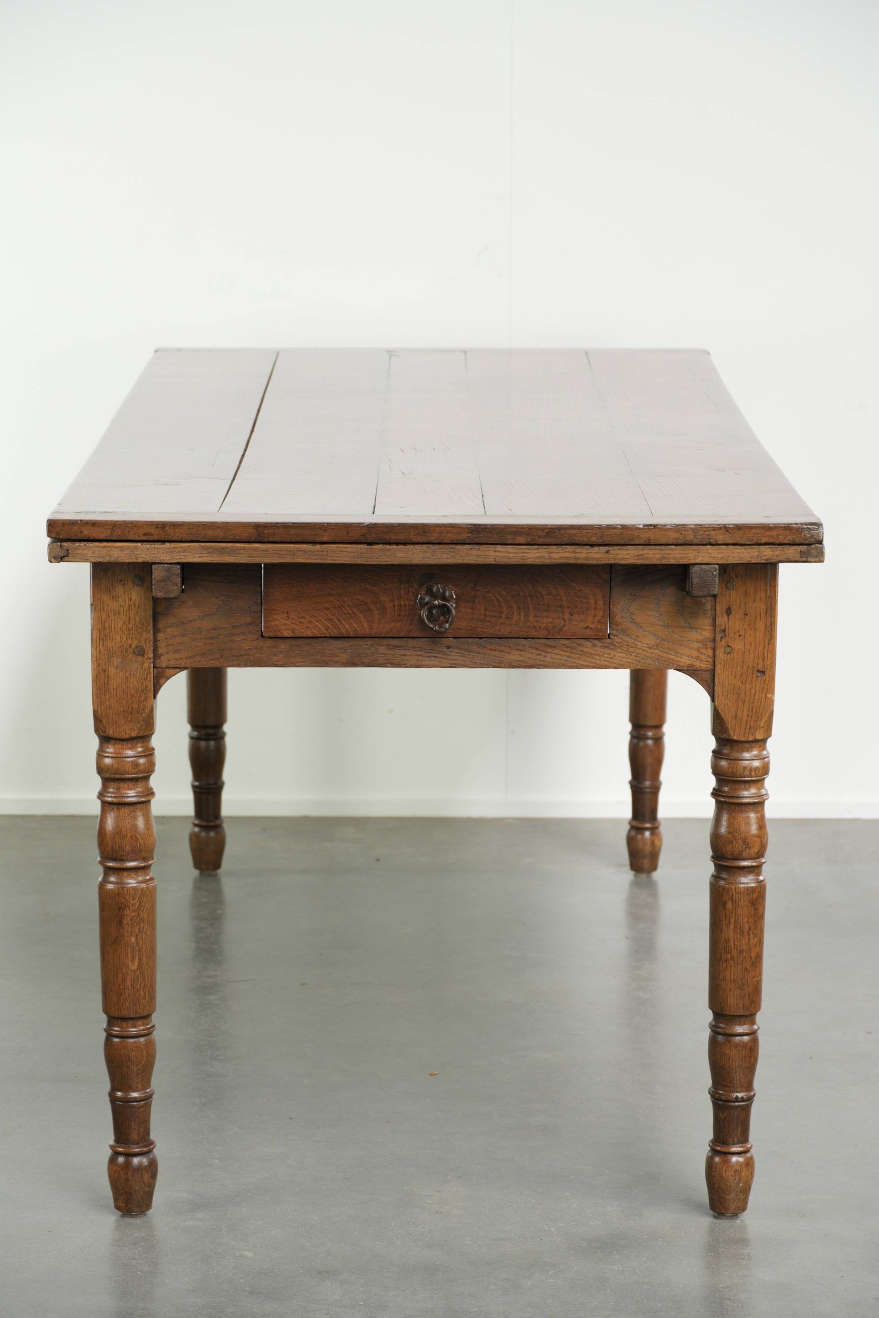 Antique oak dining table from the late 18th century with extendable leaves