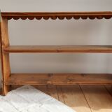 Vintage pine wall shelf with a scalloped front.