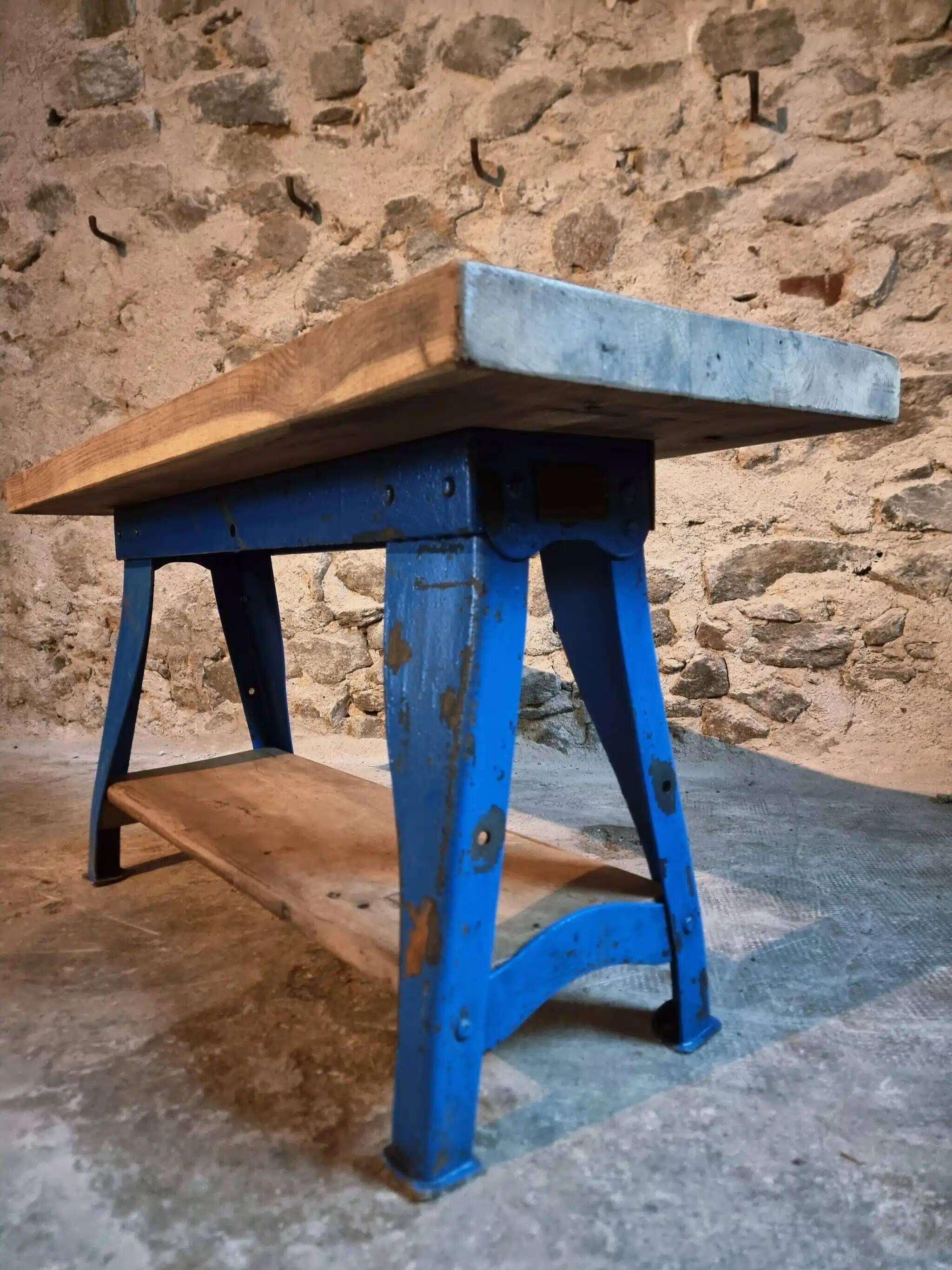 Vintage industrial workbench table with cast iron legs (Aux Forges de Vulcain)
